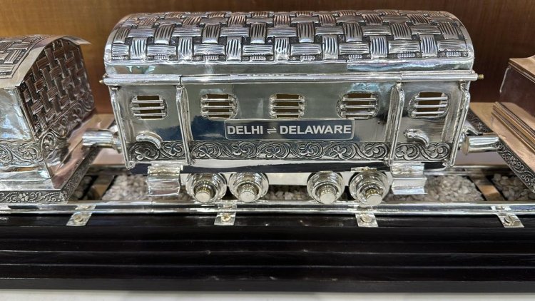 Prime Minister Modi presents President Biden with a silver, hand-engraved train model as a gift.